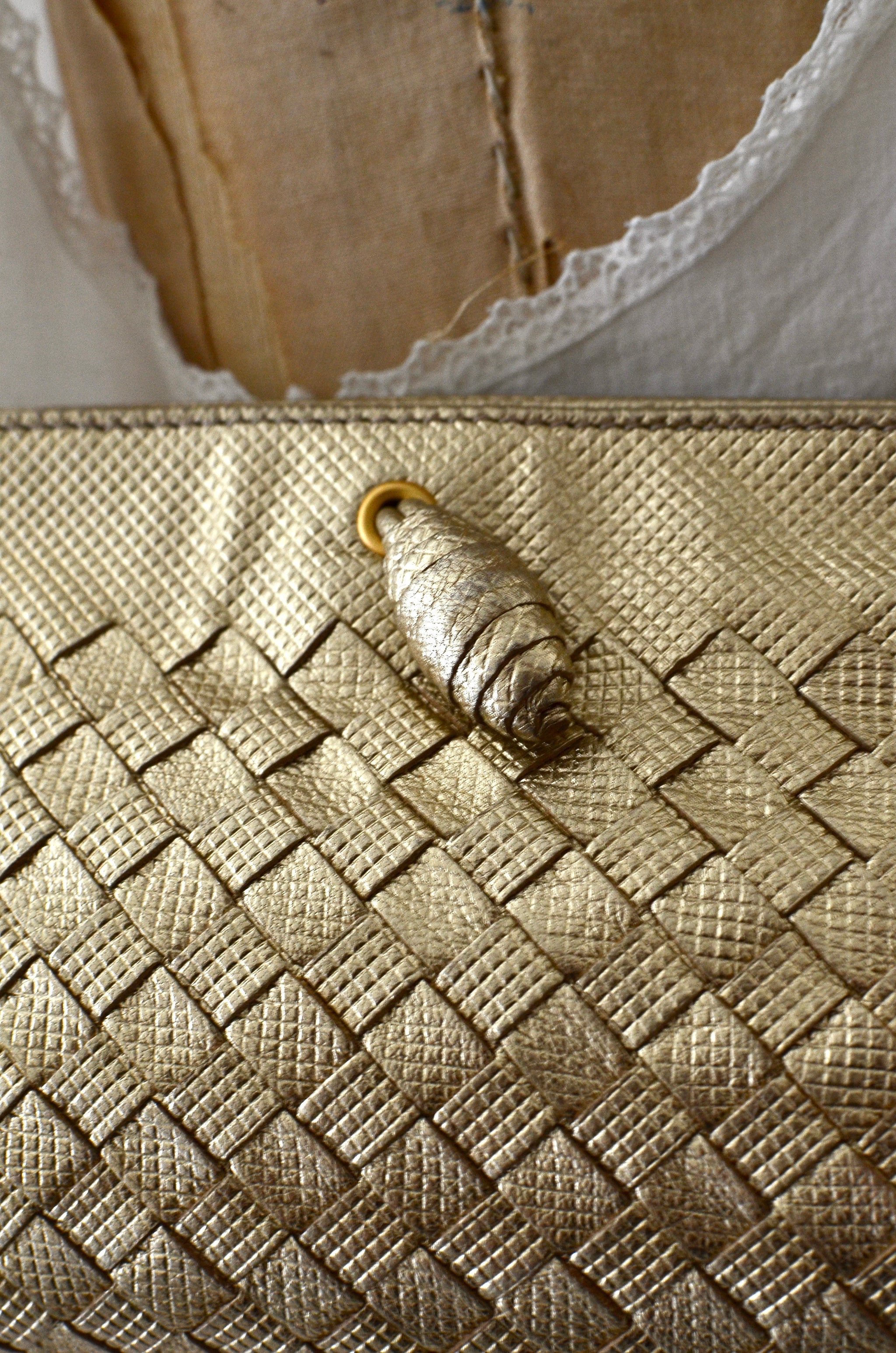 Bottega Veneta Intrecciato Leather Pochette Bag Gold