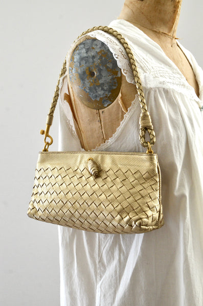 Bottega Veneta Intrecciato Leather Pochette Bag Gold